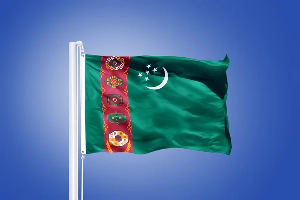 Flag of Turkmenistan flying against a blue sky — Stock Photo, Image