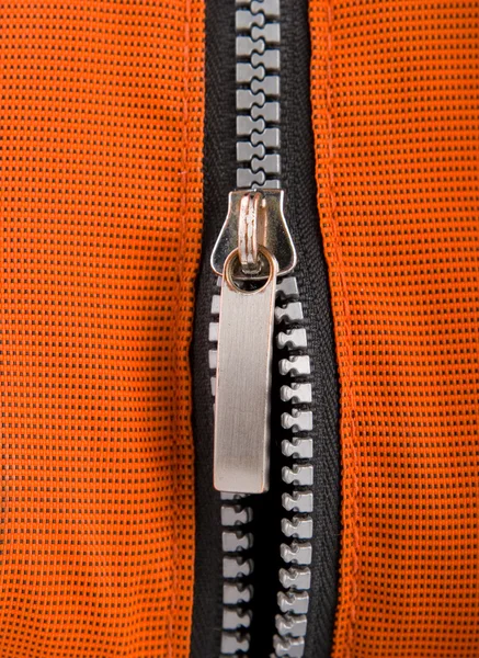 Close up zipper on an orange background — Stock Photo, Image