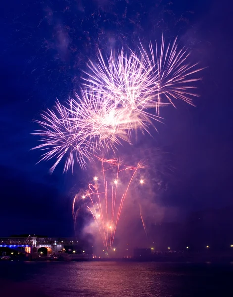 Colorful festival fireworks at the river — Stock Photo, Image