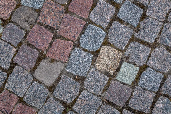 Granit kullerstensbelagd trottoaren bakgrund — Stockfoto