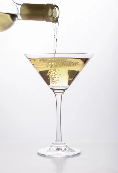 White wine pouring in a glass — Stock Photo, Image