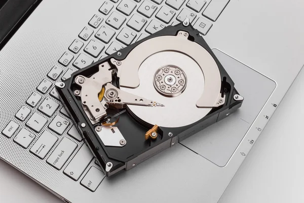 HDD over notebook keyboard — Stock Photo, Image