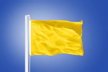 Yellow flag flying against clear blue sky clipart