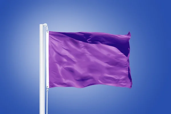 Purple flag flying against clear blue sky — Stock Photo, Image