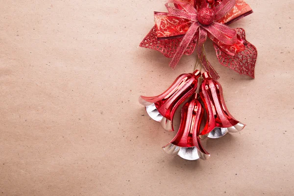 Bells and red loop on paper background — Stock Photo, Image