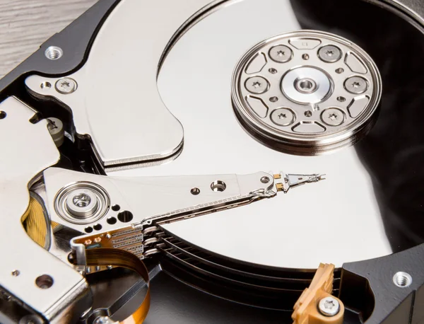 Open harddisk on wood desk — Stock Photo, Image