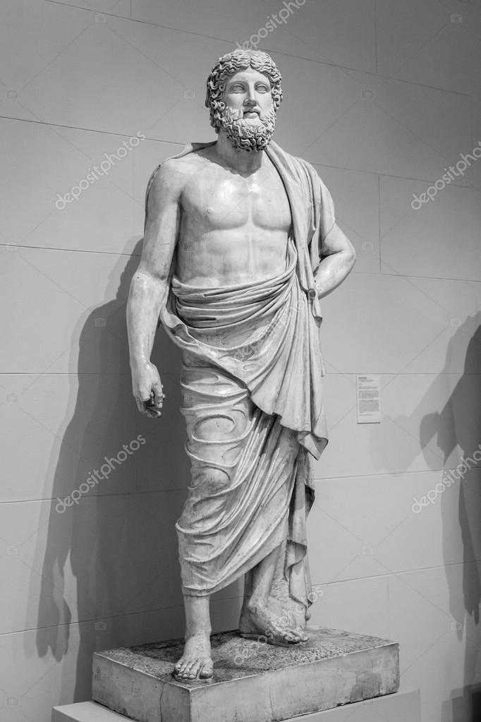 Ancient greek statue of a man Stock Photo by ©gilmanshin 89681366