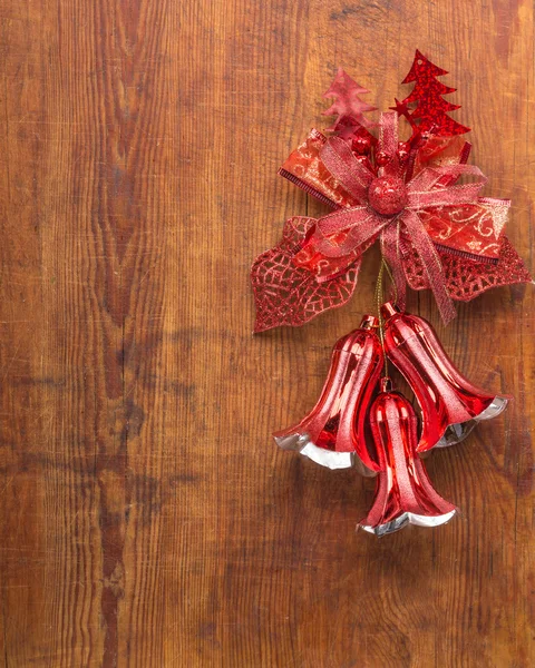 Christmas bells on wooden background — Stock Photo, Image