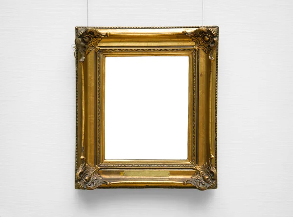 Zlata prázdný rám na bílé zdi — Stock fotografie
