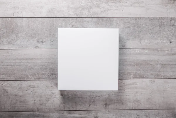 Pared de madera y tarjeta de papel en blanco —  Fotos de Stock