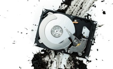 Open computer hard disk drive on muddy background clipart