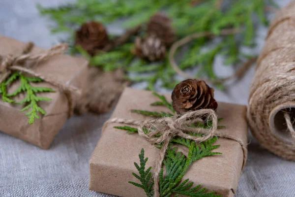 New Year's gifts in craft packaging. Christmas and New Year holidays background, selective focus