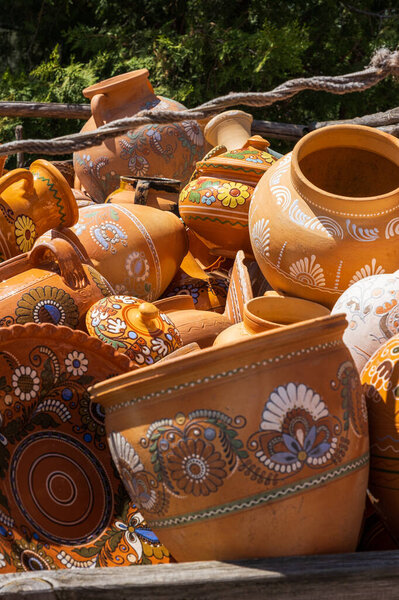 Opishnya, Poltava region, Ukraine - May 16, 2021: An abundance of ceramic dishes. Opishnya National Museum-Reserve of Ukrainian Ceramics