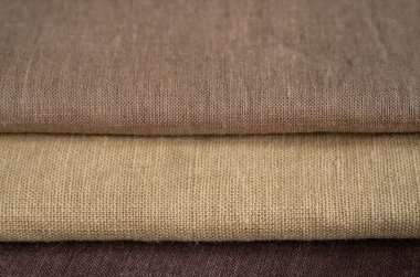 Kahverengi keten desenli arka plan. Kumaş şeritleri. Arka plan olarak doğal keten dokusu