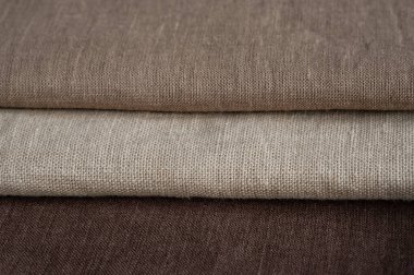 Kahverengi keten desenli arka plan. Kumaş şeritleri. Arka plan olarak doğal keten dokusu