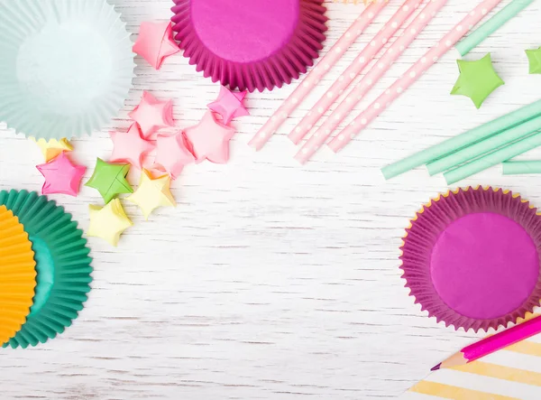 Bright paper stars, cupcake cups and stars Stock Image