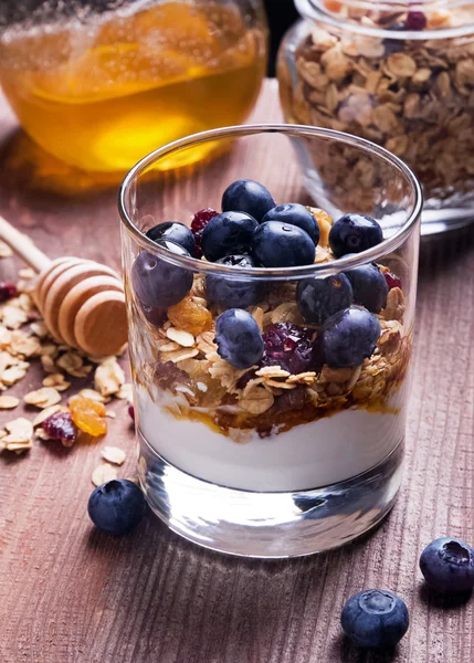 Yougurt with granola in the glass — Stock Photo, Image