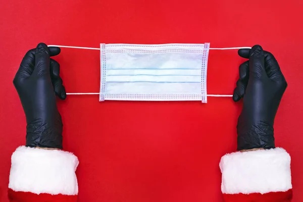 Der Weihnachtsmann wird eine medizinische Schutzmaske tragen. — Stockfoto