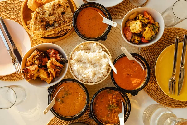 Selection of curries and rice. Indian food in small bowls. — Stock Photo, Image