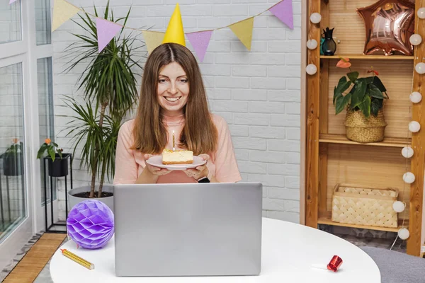 Woman celebrating her birthday at home and communicate with friends by video chat — Stock Photo, Image