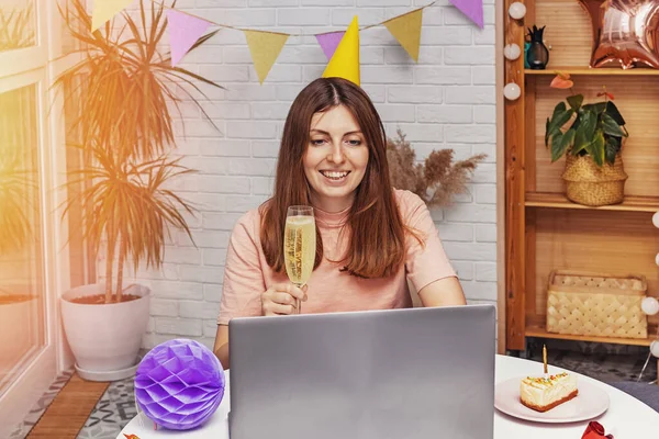 Woman celebrating her birthday at home and communicate with friends by video chat — Stock Photo, Image