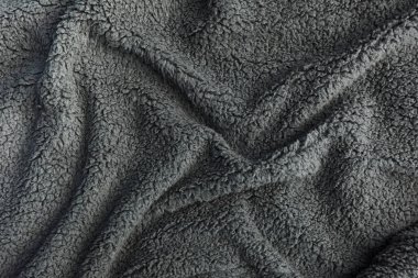 Gri sahte kürk battaniyesi dokusu yakın plan.