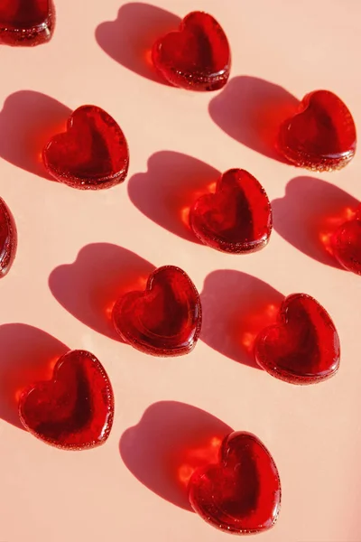 Small heart shaped jelly candies with hard shadows. — Stock Photo, Image