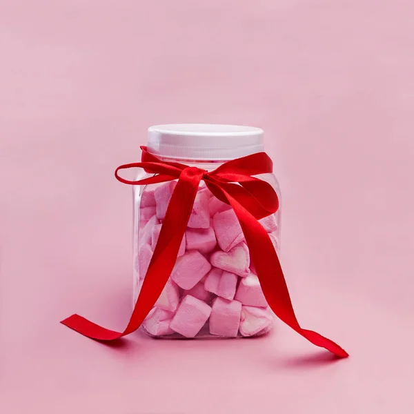 Jar with heart shaped pink marshmallows — Stock Photo, Image