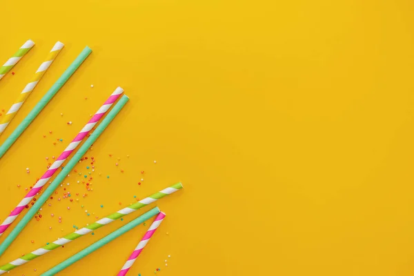 Multicolored party drinking straws and sugar sprinkles — Stock Photo, Image