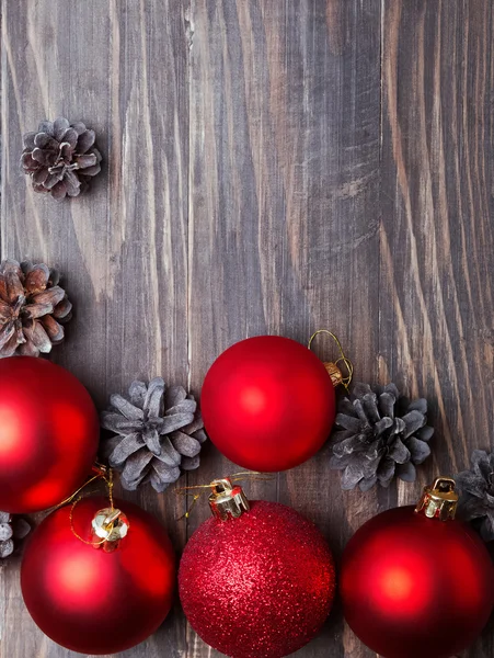 Red christmas balls and pine cones — Stock Photo, Image