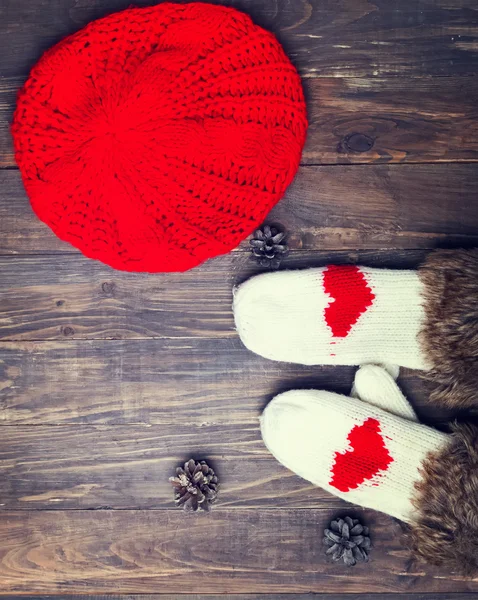 Cute knitted mittens with red hearts — Stock Photo, Image
