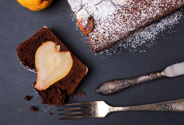 A piece of delicious chocolate cake with pears — Stock Photo, Image