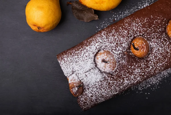 Dark style photo of chocolate cake with pears — Stock Photo, Image