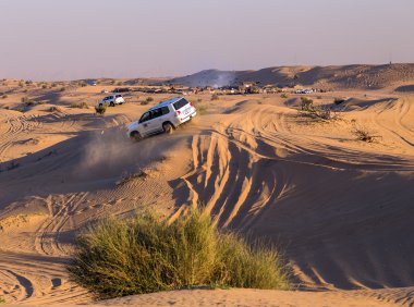 Driving on jeeps Desert Safari clipart