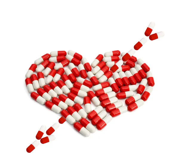 Red pills heart capsule — Stock Photo, Image