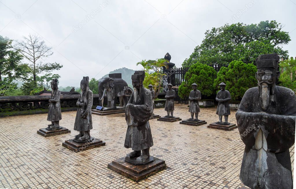 Sculpture honor guard of stone bodyguards mandarins elephants and horses Khai Dinh Royal Tomb in Hue, Vietnam