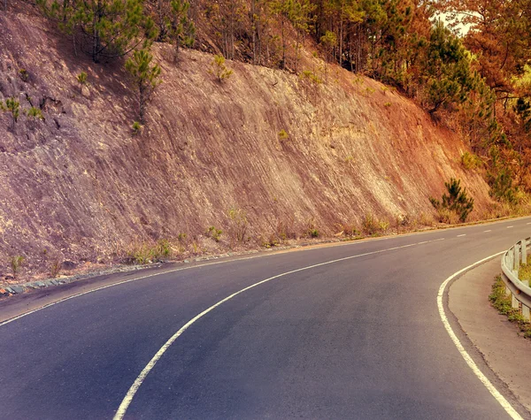 Sunshine asphalt road in mountain — Stock Photo, Image