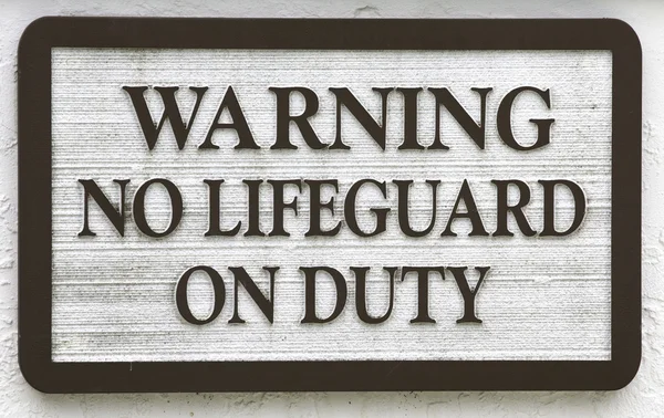 Znak: "ostrzeżenie nie ratownik na służbie" — Zdjęcie stockowe