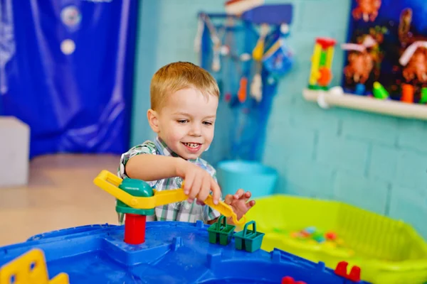 Boy playing water toy — Stock Photo, Image