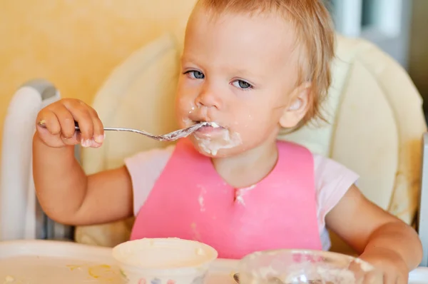 Eating baby girl — Stock Photo, Image