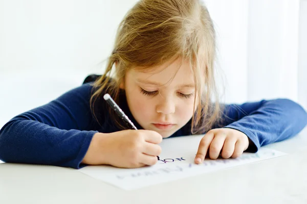 Girl is writting — Stock Photo, Image