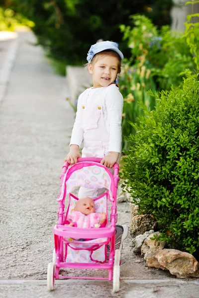 Girl walking with  stroller — Stock Photo, Image