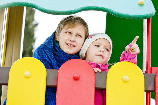 Brother and sister on the playground — Stock Photo, Image
