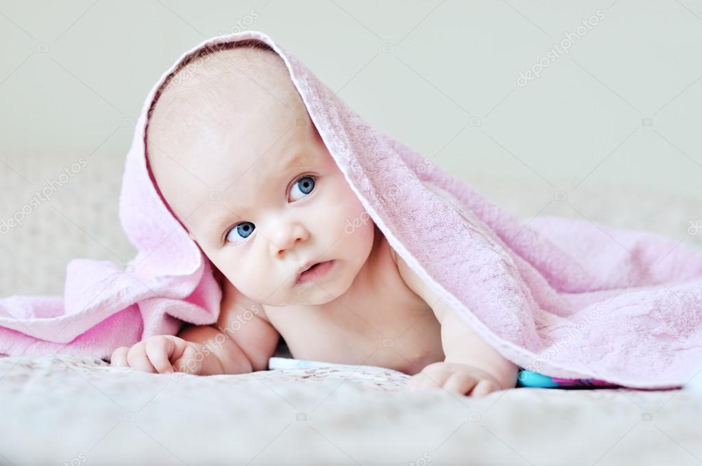 funny baby under the towel