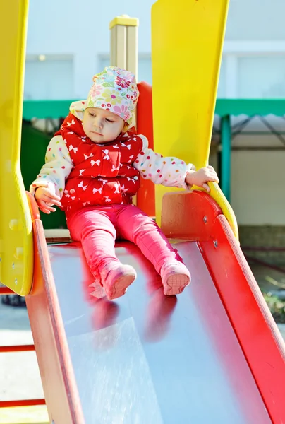 Toddler on slide — Stock Photo, Image
