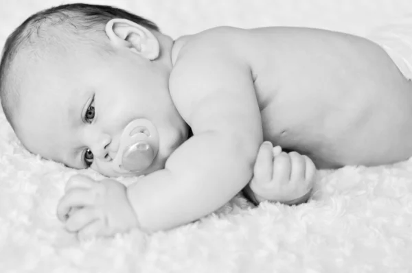 Baby with dummy — Stock Photo, Image