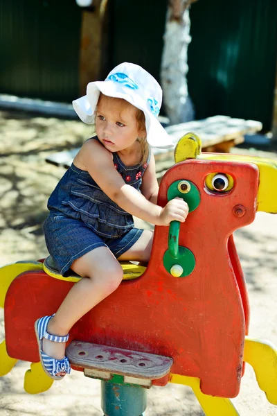 Menina no parque infantil — Fotografia de Stock