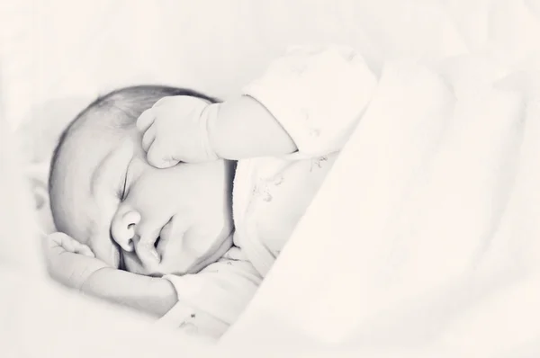 Newborn in crib — Stock Photo, Image