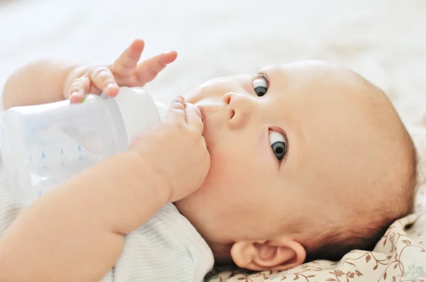 Baby with bottle — Stock Photo, Image