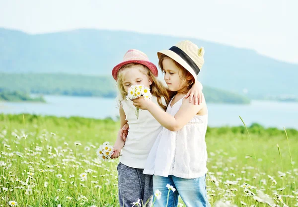 Two girls in fild — Stock Photo, Image